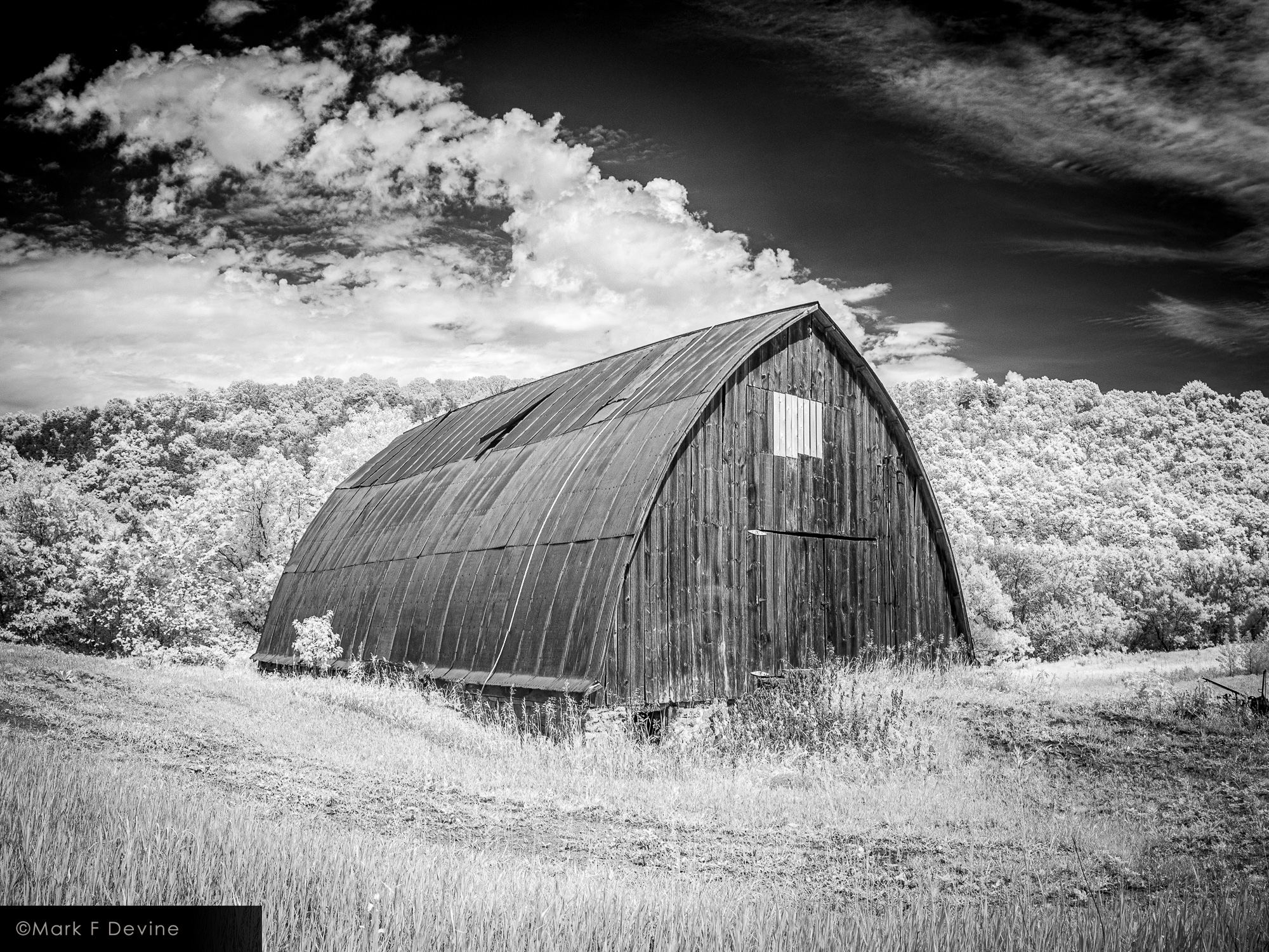 This is an infrared image of an arched roof barn which is visible from the Root River State Trail near Lanesboro, Minnesota....