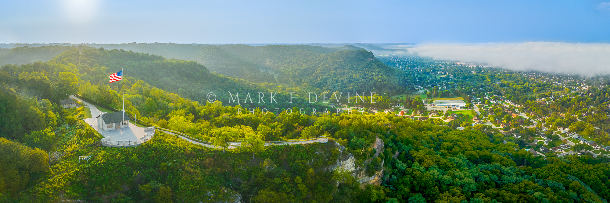 Sunrise colors pop on this panoramic print. The view is looking south from a point in front of Grandad Bluff in La Crosse, Wisconsin...