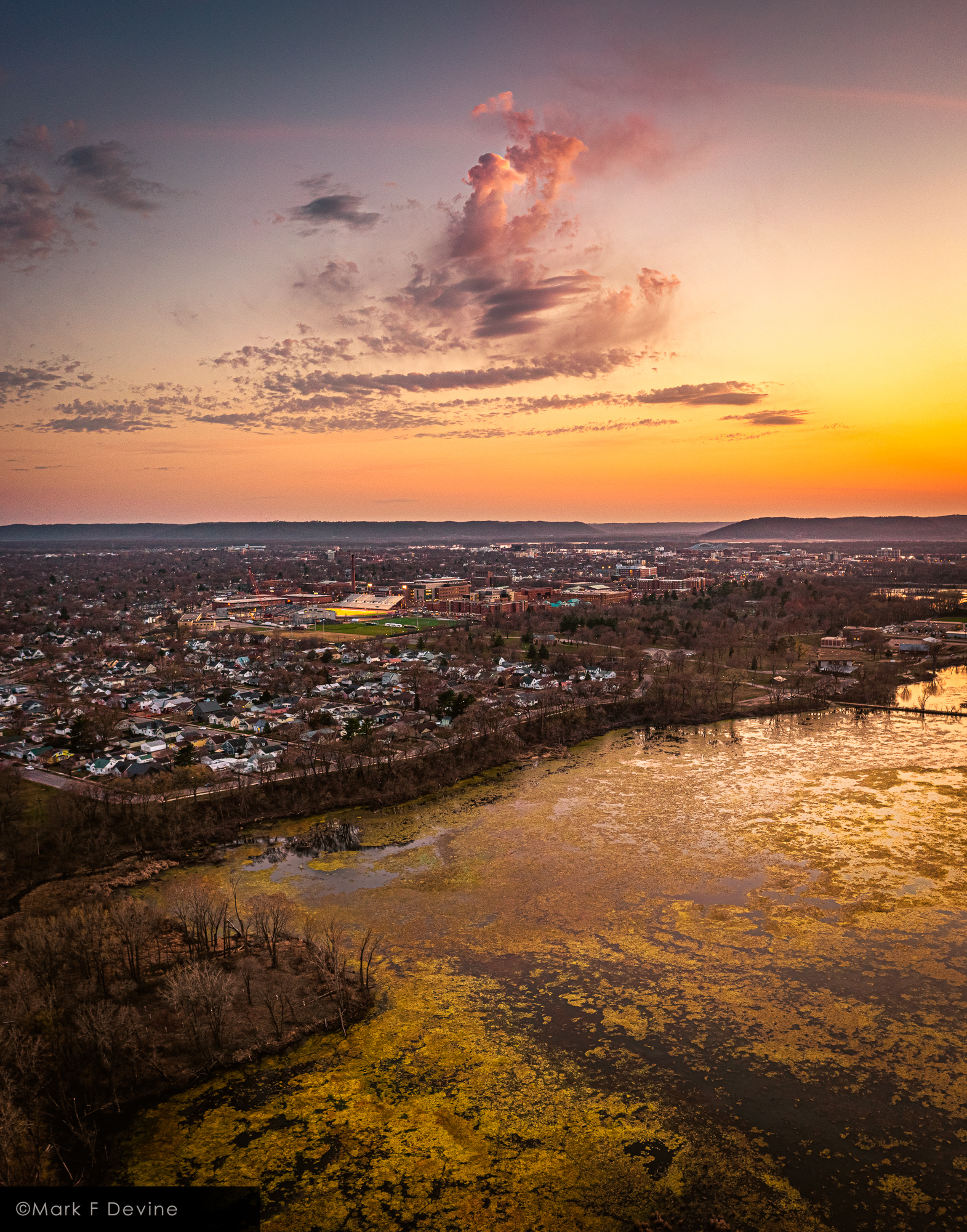 A lone cloud at sunset. View is from a point over Myrick Marsh looking towards downtown La Crosse.