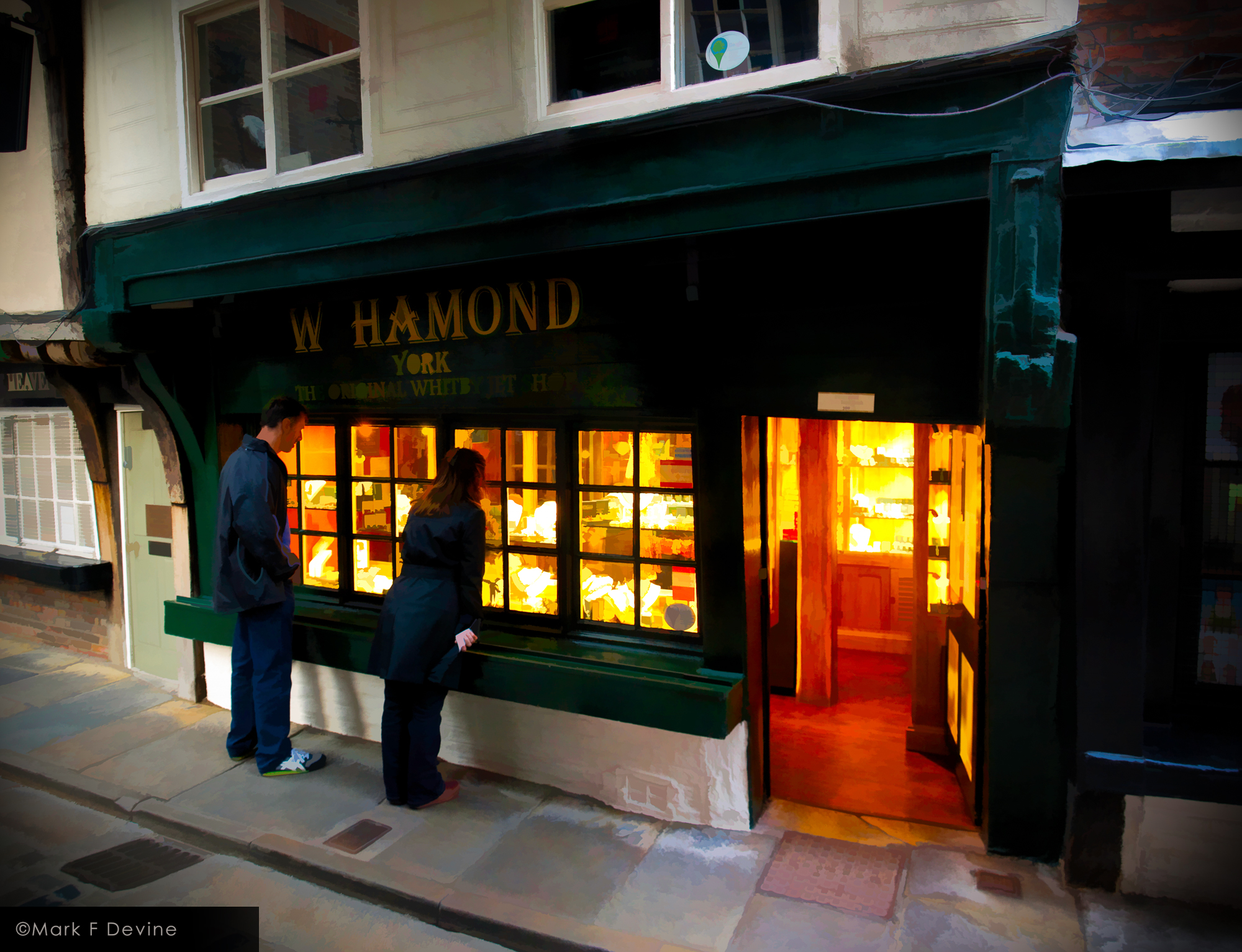 A young couple is window shopping at W Hamond Jewelers in The Shambles at York, England.